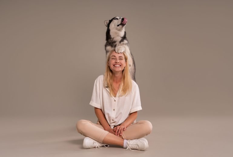 full-shot-woman-with-dog-studio female dog